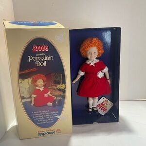 Annie Genuine Porcelain Doll with Red Dress. 1982. Vintage. Box has some damage.